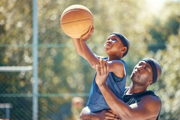 Parents supporting their child athletes.